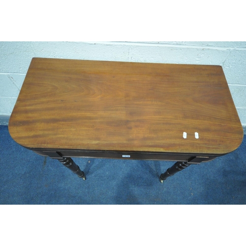 1418 - AN EARLY 20TH CENTURY MAHOGANY FOLD OVER CARD TABLE, with green baize lining, internal storage, on c... 