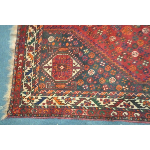 1419 - A 20TH CENTURY PERSIAN HAMADAN RUG, the red field within three medallions, and multi strap border, 2... 