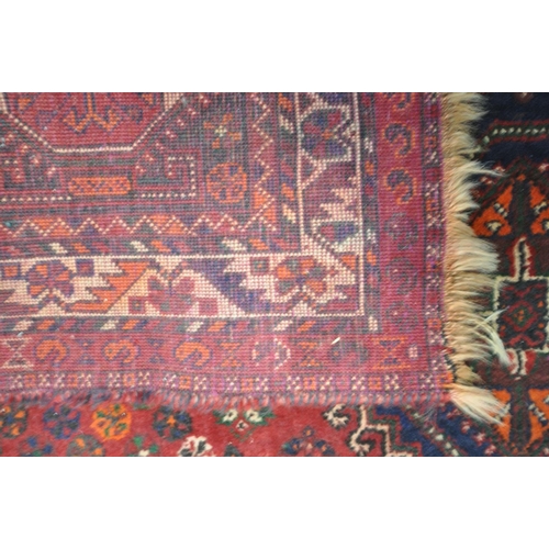 1419 - A 20TH CENTURY PERSIAN HAMADAN RUG, the red field within three medallions, and multi strap border, 2... 