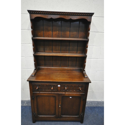 1424 - A SLIM REPRODUCTION OAK DRESSER, with two drawers, width 92cm x depth 40cm x height 175cm x height o... 