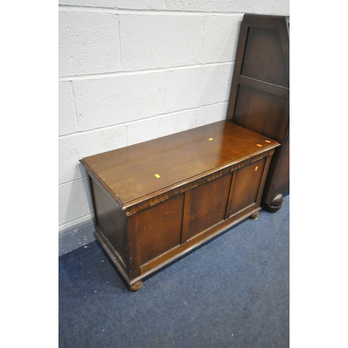 1447 - AN ART DECO OAK OPEN BOOKCASE, an oak occasional table, a fall front bureau, an oak blanket box, a d... 