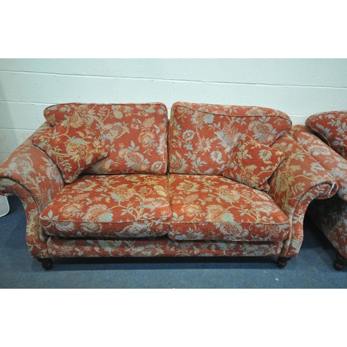 1451 - A RED FLORAL UPHOLSTERED LOUNGE SUITE, comprising of two sized sofas, length 198cm and 170cm x depth... 