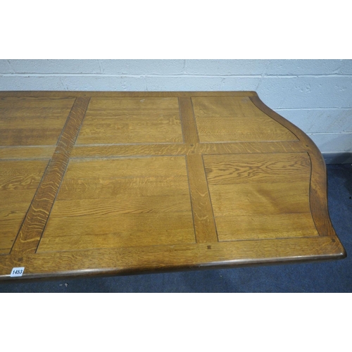 1453 - A HEAVY OAK TRESTLE DINING TABLE, with serpentine ends, length 230cm x depth 96cm x height 77cm (con... 