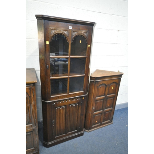 1462 - AN OAK LINENFOLD CORNER CUPBOARD, width 72cm x depth 39cm x height 176cm (key) a reproduction oak ha... 