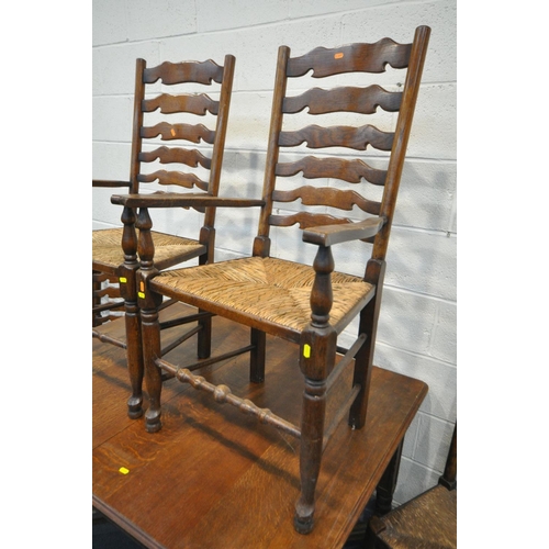 1464 - AN EARLY 20TH CENTURY FRENCH OAK EXTENDING DINING TABLE, on square tapered legs, united by bobbin tu... 