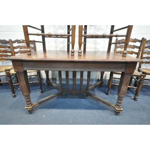 1464 - AN EARLY 20TH CENTURY FRENCH OAK EXTENDING DINING TABLE, on square tapered legs, united by bobbin tu... 