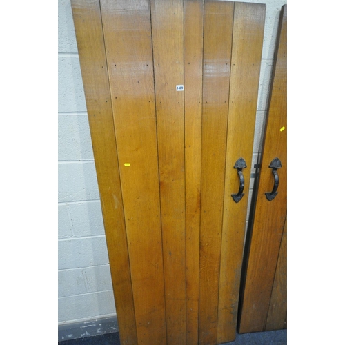 1469 - TWO SIZED OAK SLATTED INTERIOR COTTAGE DOOR, with iron handles and hinges, 75.5cm x 194cm & 59.5cm x... 