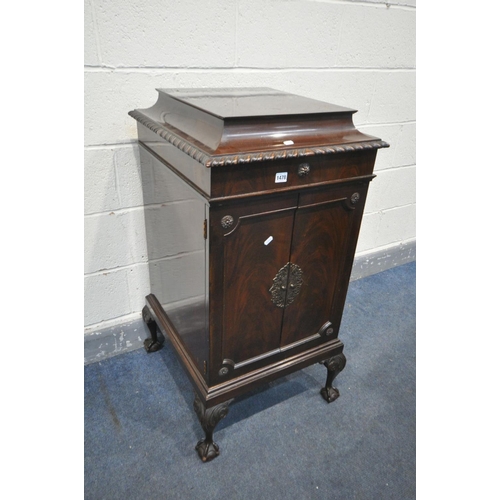 1478 - AN EDWARDIAN MAHOGANY MUSIC CABINET, with two doors enclosing five shelves, on ball and claw feet, w... 