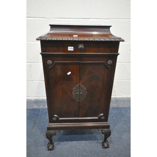 1478 - AN EDWARDIAN MAHOGANY MUSIC CABINET, with two doors enclosing five shelves, on ball and claw feet, w... 