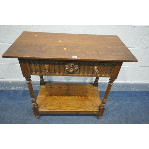 1484 - AN OAK SIDE TABLE, with a single frieze drawer, on turned legs, united by an undershelf, width 84cm ... 