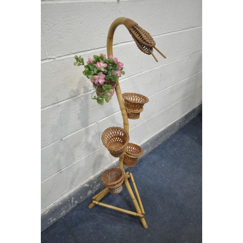 1488 - A MID CENTURY BAMBOO SNAKE PLANTER, complete with five bamboo baskets, height 124cm