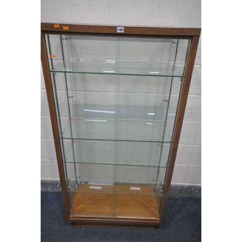 1493 - A SHOP/COLLECTORS DISPLAY CABINET, with four glass shelves, and double sliding doors, width 78cm x d... 