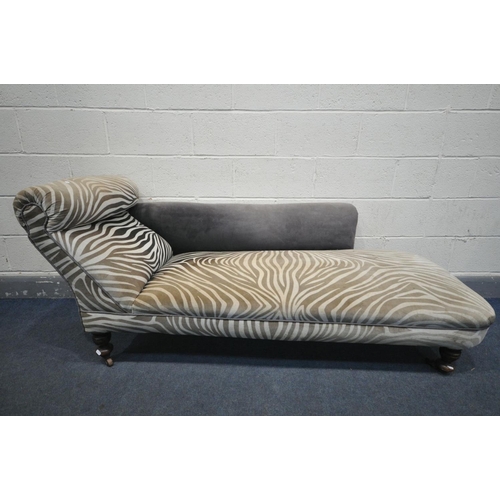 1499 - AN EDWARDIAN ZEBRA PRINT UPHOLSTERED CHAISE LONGUE, length 175cm (condition:-stains to upholstery)