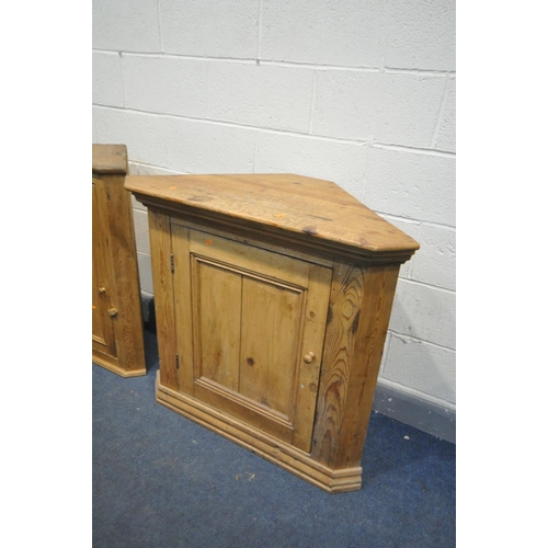 1503 - A LOW 19TH CENTURY PINE CORNER CUPBOARD, with a panelled door, width 100cm x depth 49cm x height 93c... 