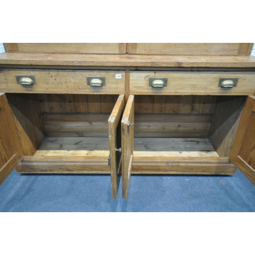 1505 - A 19TH CENTURY PITCH PINE FARMHOUSE BOOKCASE, the upper section with double astragal glazed doors, e... 