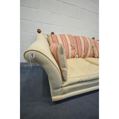 1508 - A KNOWLE STYLE CREAM UPHOLSTERED TWO SEATER SOFA, with tie back drop arms, on turned legs, width 195... 