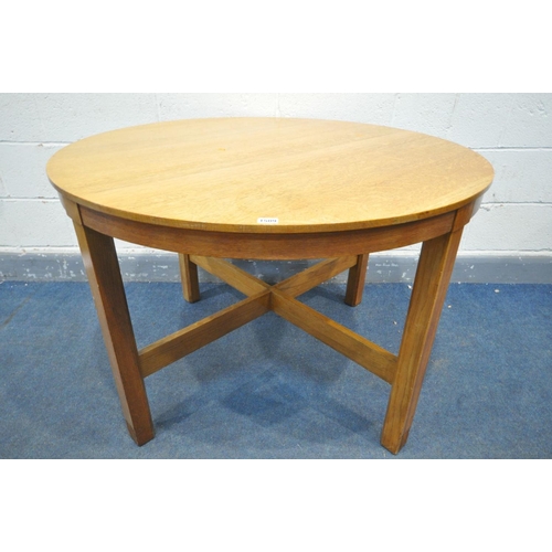 1509 - A 1930'S OAK CIRCULAR DINING TABLE, possibly by Heals & Sons, on square legs, united by a cross stre... 