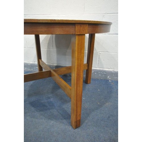 1509 - A 1930'S OAK CIRCULAR DINING TABLE, possibly by Heals & Sons, on square legs, united by a cross stre... 