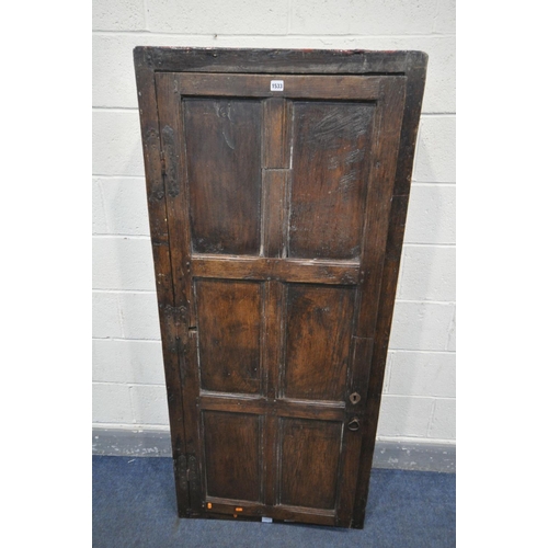 1533 - A 17TH CENTURY OAK SINGLE DOOR CUPBOARD, the door with six panels enclosing five shelves, width 74cm... 