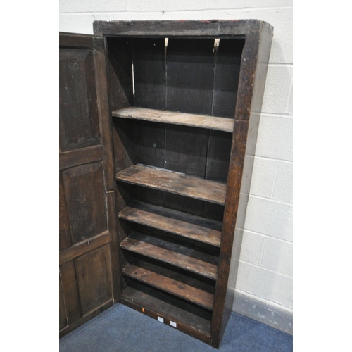 1533 - A 17TH CENTURY OAK SINGLE DOOR CUPBOARD, the door with six panels enclosing five shelves, width 74cm... 