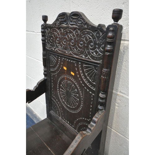 1535 - AN 18TH CENTURY CARVED OAK WAINSCOTE CHAIR, with scrolls surrounding a geometric decorated panel, op... 