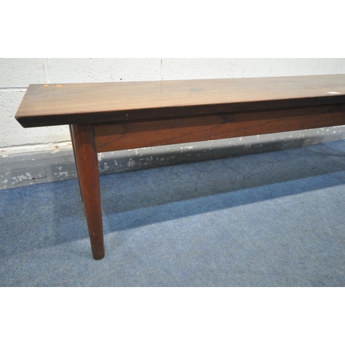 1536 - A 1960'S LONG RECTANGULAR DANISH STYLE SOLID MAHOGANY TOP COFFEE TABLE, on a teak base with tapered ... 