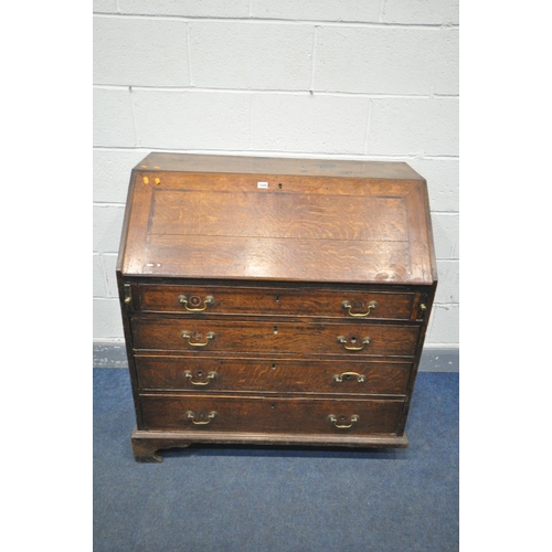 1549 - A GEORGIAN OAK AND BOX INLAID BUREAU, the fall front  enclosing a fitted interior, over four long dr... 