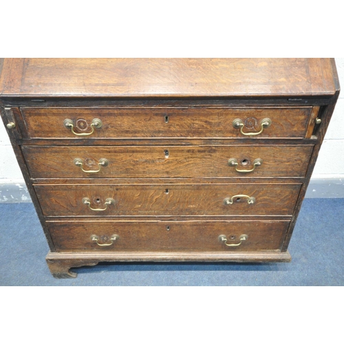 1549 - A GEORGIAN OAK AND BOX INLAID BUREAU, the fall front  enclosing a fitted interior, over four long dr... 