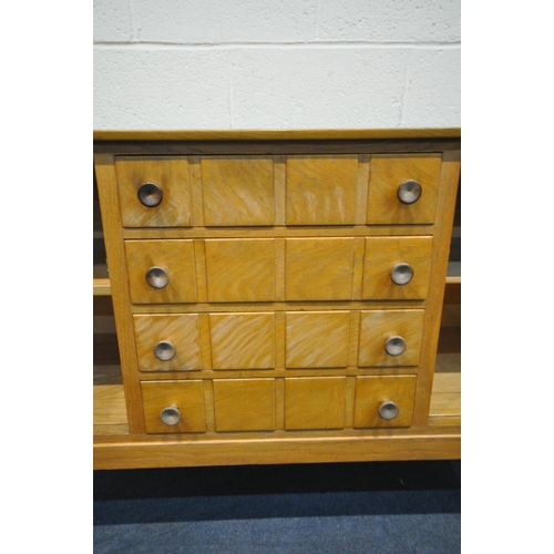 1566 - A GORDON RUSSELL OF BROADWAY 1960'S SIDEBOARD, with cupboard doors flanking four drawers, the top dr... 