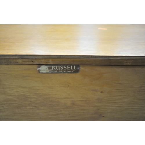 1566 - A GORDON RUSSELL OF BROADWAY 1960'S SIDEBOARD, with cupboard doors flanking four drawers, the top dr... 