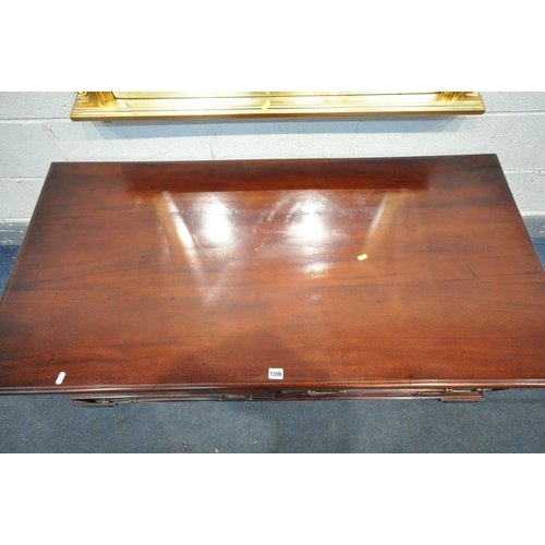 1596 - A LARGE MODERN MAHOGANY COFFEE TABLE, with four drawers, length 137cm x depth 68cm x height 52cm, an... 