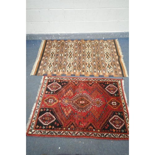 1605 - A RED GROUNG PERSIAN SHIRAZ RUG, length 136cm x depth 92cm, and another rug (good condition) (2)