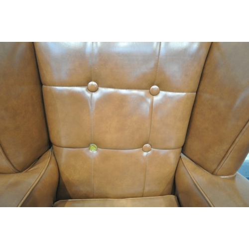 1612 - A BROWN LEATHERETTE BUTTONED THREE PIECE SUITE, comprising a three seater wing back sofa, length 182... 