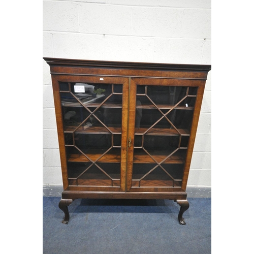 1619 - A CHIPPENDALE STYLE MAHOGANY GLAZED TWO DOOR BOOKCASE, three shelves, on front cabriole legs, length... 