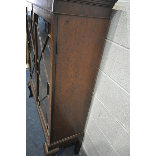 1619 - A CHIPPENDALE STYLE MAHOGANY GLAZED TWO DOOR BOOKCASE, three shelves, on front cabriole legs, length... 