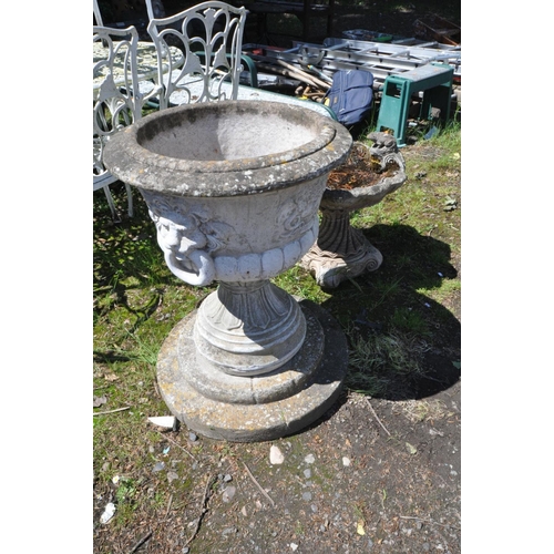 1201 - A COMPOSITE URN, with lion faces and fluted bottom on a separate base and plinth, diameter 55cm x ov... 