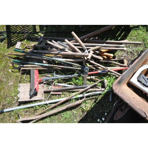 1202 - A COLLECTION OF VARIOUS GARDEN TOOLS to include spades, forks, shears etc together with a metal whee... 