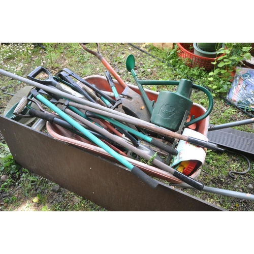 1209 - A QUANTITY OF VARIOUS GARDEN TOOLS include spades, shears, forks etc together with a metal and plast... 