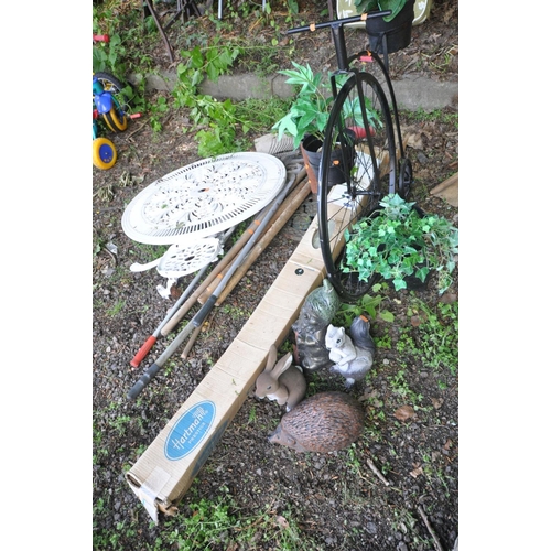 1214 - A BLACK PAINTED METAL FRAMED PLANT POT HOLDER in the shape of a penny farthing together with a small... 