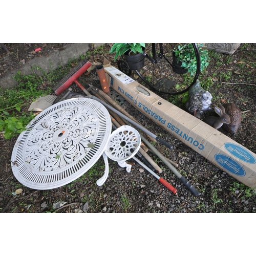 1214 - A BLACK PAINTED METAL FRAMED PLANT POT HOLDER in the shape of a penny farthing together with a small... 