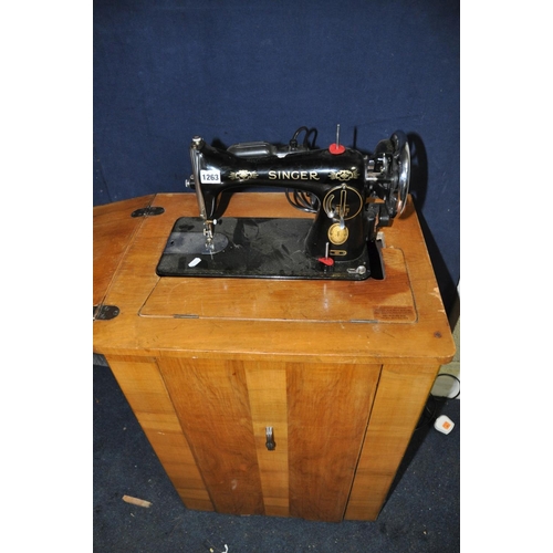 1263 - A SINGER 15K SEWING MACHINE with power cable and pedal (mounted on walnut cabinet with box of access... 