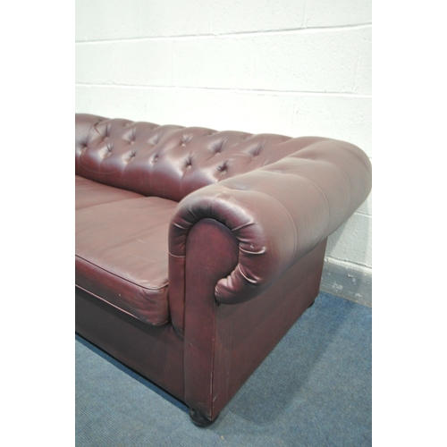 1135 - A BURGUNDY LEATHERETTE CHESTERFIELD SOFA BED, length 180cm x depth 83cm x height 66cm (condition:-te... 