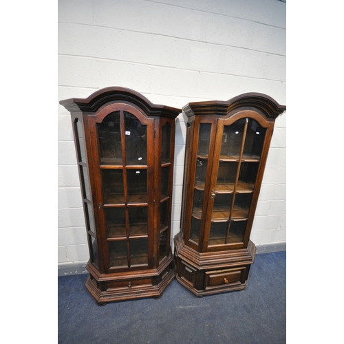 1147 - TWO SIMILAR OAK GLAZED SINGLE DOOR DISPLAY CABINETS, with dome top, canted corners and a single draw... 