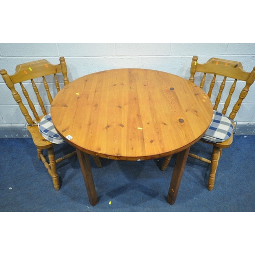 1152 - A PINE CIRCULAR KITCHEN TABLE, diameter 102cm x height 74cm, along with two chairs (general wear) (3... 