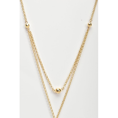 10 - AN 18CT GOLD CHAIN NECKLACE, a fine trace chain, fitted with an additional part chain to appear as a... 