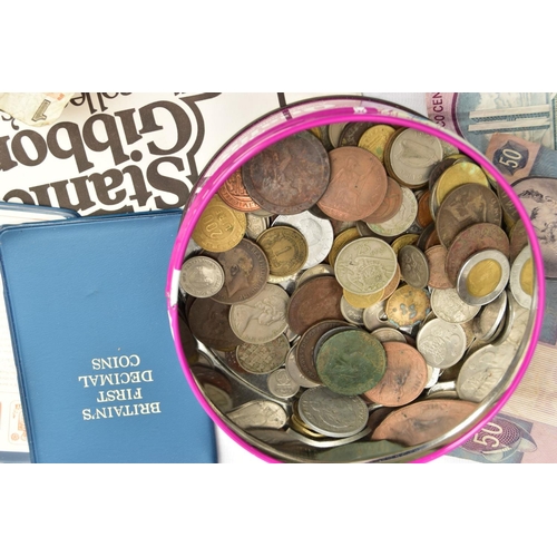 123 - A CARDBOARD BOX AND TIN OF COINS, to include 9x Britain's first decimal walleted coins, a tin of mix... 