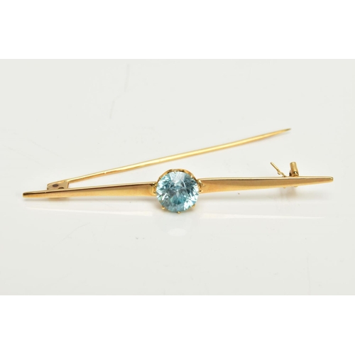 126 - A YELLOW METAL ZIRCON BAR BROOCH, set with a circular blue zircon, measuring approximately 8.5 x 8.4... 