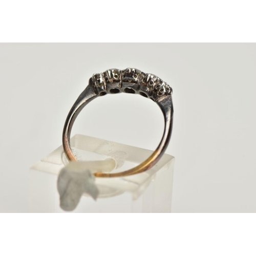 132 - A DIAMOND FIVE STONE RING, set with graduating early brilliant cut diamonds, claw set, to the taperi... 