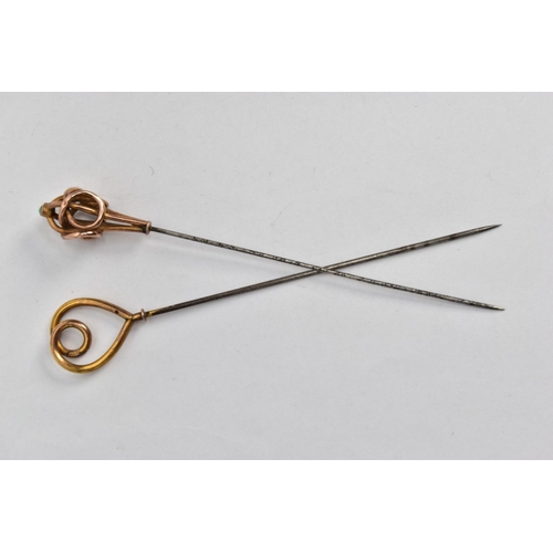 135 - TWO EARLY 20TH CENTURY HAT PINS, one designed as a stylised knot with turquoise cabochon accent, one... 