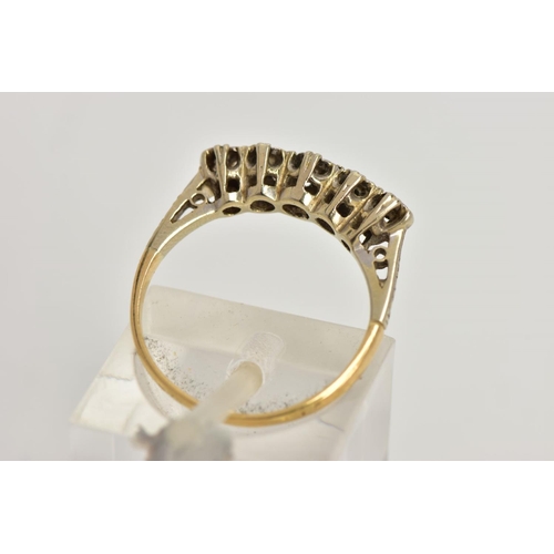 14 - A YELLOW METAL DIAMOND HALF ETERNITY RING, designed with a row of five illusion set single cut diamo... 